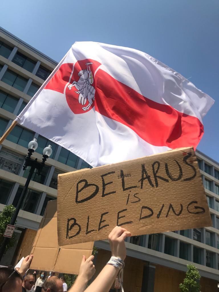 Protest sign: "Belarus is Bleeding"