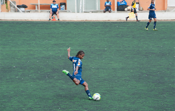 Girl playing soccer in Brazil