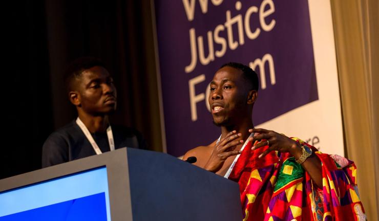  Jonathan Osei Owusu, the founder and executive director of the POS Foundation, presents during the 2022 World Justice Challenge showcase