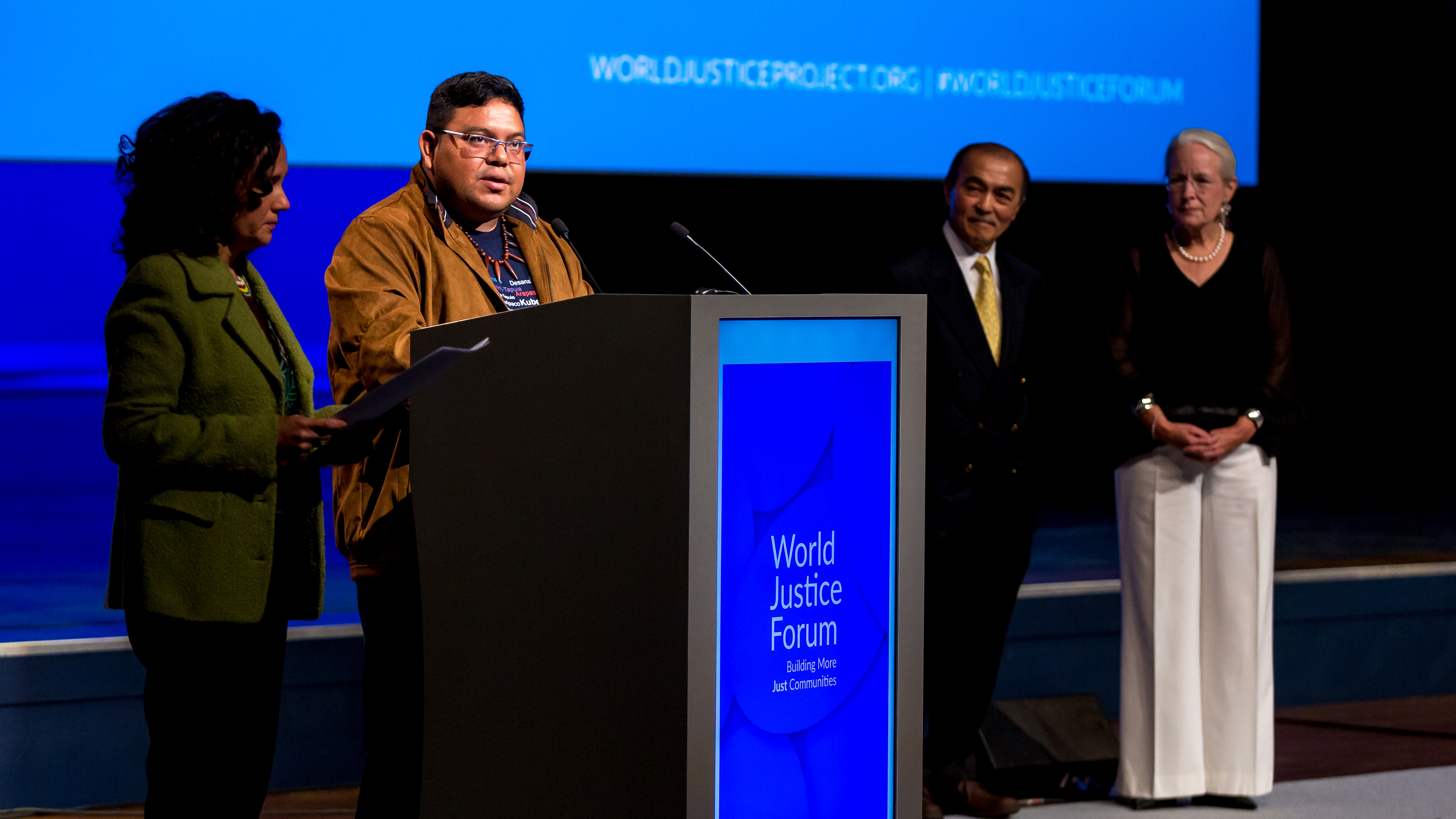 Marivelton Barroso and Juliana Radler accept the WJP Rule of Law award on behalf of Rede Wayuri.