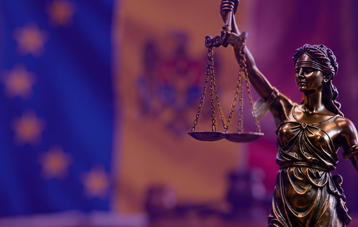  Lady Justice, with the Moldovan and EU flags behind