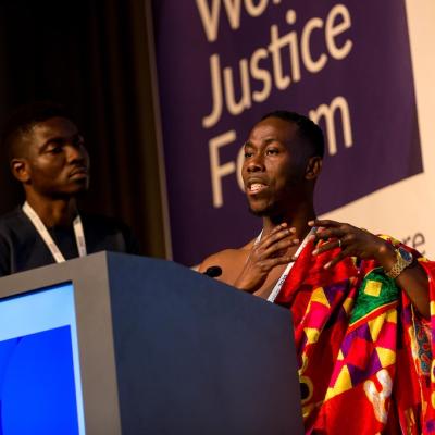 Jonathan Osei Owusu from the POS Foundation (Ghana) presents at one of the Access to Justice World Justice Challenge Showcases.